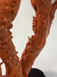 A large Chinese carved red coral group with birds on floral branches, 19/20th C.