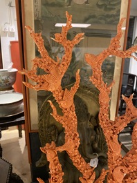 A large Chinese carved red coral group with birds on floral branches, 19/20th C.