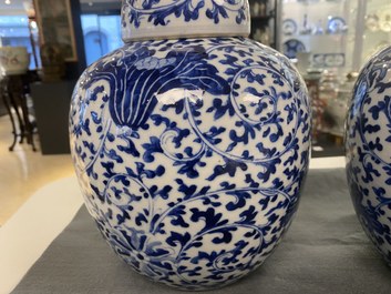 Three Chinese blue and white jars and covers with floral scrolls, 19th C.