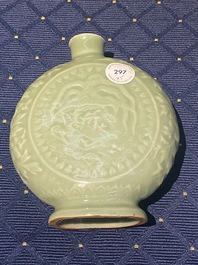 Three Chinese monochrome celadon and blanc de Chine vases and two bowls, 19/20th C.