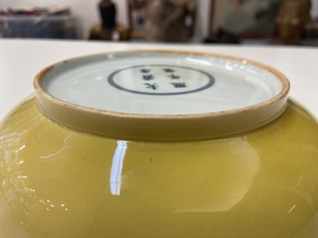A Chinese monochrome yellow-glazed plate, Kangxi mark and of the period