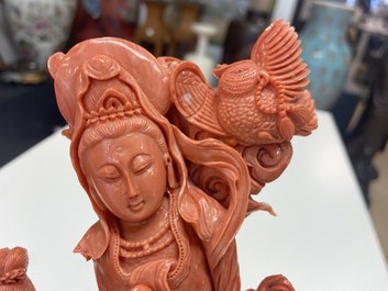 A Chinese carved red coral 'Guanyin and servant' group, 19/20th C.