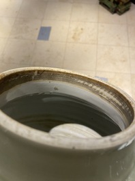 Un vase en porcelaine de Chine en bleu, blanc et rouge de cuivre &agrave; fond c&eacute;ladon, Kangxi