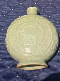 Three Chinese monochrome celadon and blanc de Chine vases and two bowls, 19/20th C.