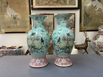 A pair of Chinese famille rose turquoise-ground vases with butterfly handles, 19th C.