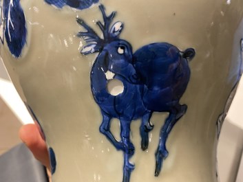 Un vase en porcelaine de Chine en bleu, blanc et rouge de cuivre &agrave; fond c&eacute;ladon, Kangxi