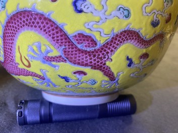 A Chinese yellow-ground famille rose 'dragon and phoenix' bowl, Xuantong mark and of the period