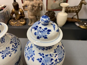 Three Chinese blue and white vases and covers, Kangxi mark, 19th C.