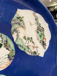 A Chinese famille verte powder blue-ground dish, 19th C.