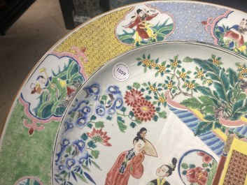 Un grand plat en porcelaine de Chine famille rose &agrave; d&eacute;cor de figures devant un temple, Yongzheng