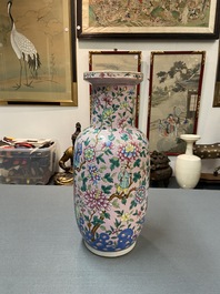 A Chinese pink-ground famille rose rouleau vase, 19th C.
