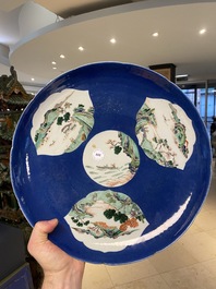 A Chinese famille verte powder blue-ground dish, 19th C.