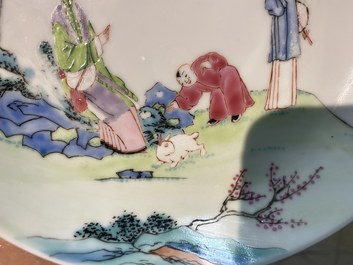 Een Chinese famille rose kop en schotel met dames en een jongen met konijn, Yongzheng