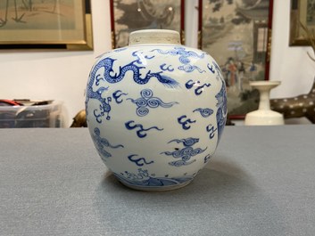 A Chinese blue and white 'dragon and phoenix' jar with wooden lid, Chenghua mark, Kangxi