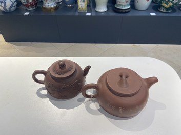 Two Chinese Yixing stoneware teapots and a famille rose 'Shou Lao' group, Kangxi and 20th C.