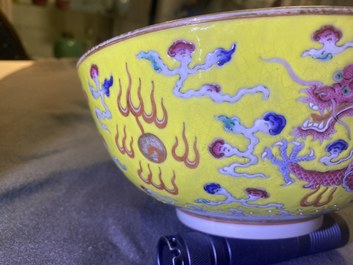 A Chinese yellow-ground famille rose 'dragon and phoenix' bowl, Xuantong mark and of the period