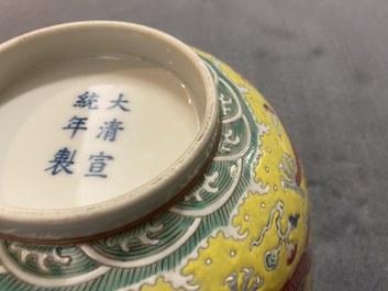 A Chinese yellow-ground famille rose 'dragon and phoenix' bowl, Xuantong mark and of the period