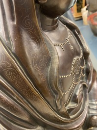 An exceptionally large Chinese silver-inlaid bronze figure of Guanyin, Yutang Shi Sou mark, Qing