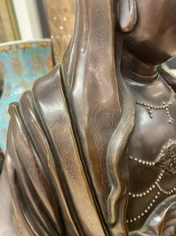 An exceptionally large Chinese silver-inlaid bronze figure of Guanyin, Yutang Shi Sou mark, Qing