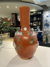 A Chinese famille rose 'sanduo' vase with applied design on a coral red ground, 19th C.