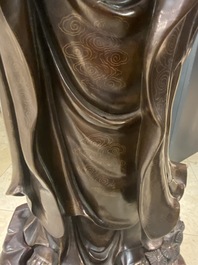 An exceptionally large Chinese silver-inlaid bronze figure of Guanyin, Yutang Shi Sou mark, Qing