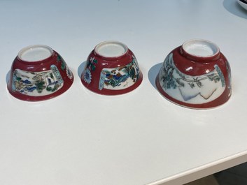 Three Chinese famille rose ruby-ground cups and saucers, Yongzheng