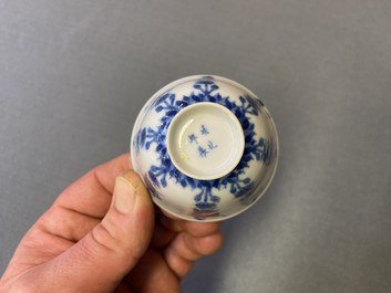 Three Chinese blue and white cups and two saucers, Kangxi
