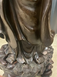 An exceptionally large Chinese silver-inlaid bronze figure of Guanyin, Yutang Shi Sou mark, Qing