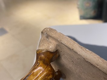 A Chinese amber- and cream-glazed pottery model of a horse, Tang