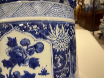 A Chinese blue and white 'gu' vase with floral and lanscape panels, Kangxi