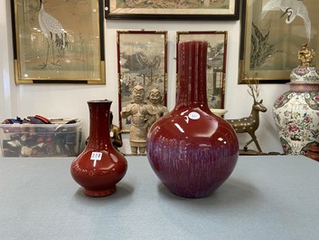 Two Chinese monochrome sang de boeuf-glazed bottle vases, 19th C.