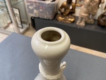 A Chinese Dehua blanc de Chine vase with applied dragon, Kangxi/Yongzheng