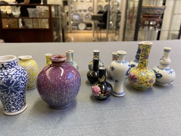 Twenty-eight Chinese blue and white and famille rose minature vases, Kangxi and later
