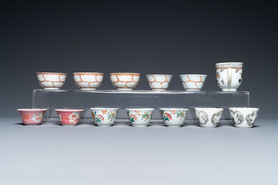 A varied collection of Chinese famille rose and grisaille cups and saucers and a 'rooster' bowl, Yongzheng/Qianlong