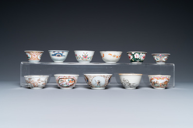 A varied collection of Chinese famille rose and grisaille cups and saucers and a 'rooster' bowl, Yongzheng/Qianlong
