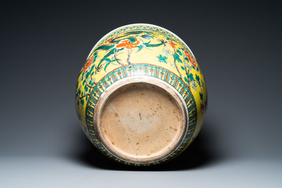 A Chinese yellow-ground famille verte 'dragons' fish bowl on gilded wooden stand, 19th C.