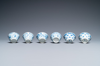 Nineteen Chinese blue and white saucers and twelve cups, Kangxi