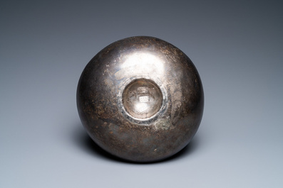 A Persian silver bowl with raised center, 8/12th C.