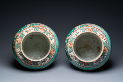 A pair of large Chinese turquoise-ground famille verte vases and covers, 19th C.