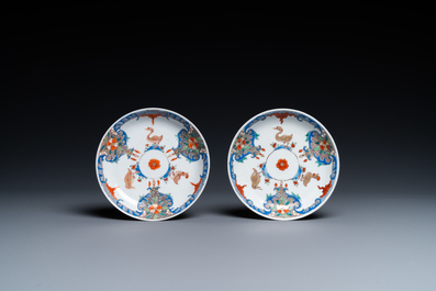 A pair of Chinese famille rose cups and saucers with aquatic birds, Qianlong