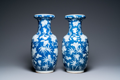 A pair of Chinese blue and white 'dragon and peony' vases, 19th C.
