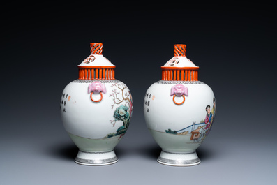 A pair of Chinese famille rose vases with reticulated covers, Qianlong mark, Republic