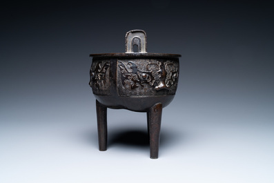 A Chinese bronze tripod censer with 'taotie' masks, Ming