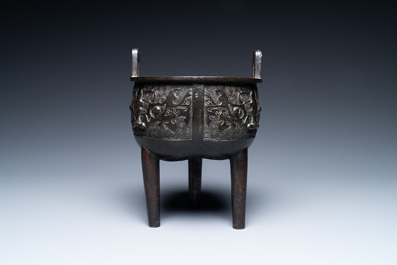 A Chinese bronze tripod censer with 'taotie' masks, Ming