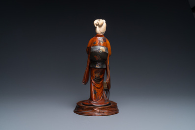 A Japanese lacquered wood, ivory and mother-of-pearl inlay 'Geisha' okimono, Meiji, 19th C.