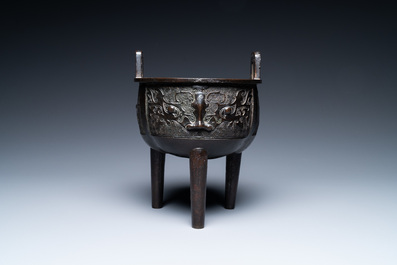 A Chinese bronze tripod censer with 'taotie' masks, Ming