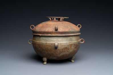 A Chinese bronze ritual tripod 'zhan' food vessel and cover, middle to late Spring and Autumn period