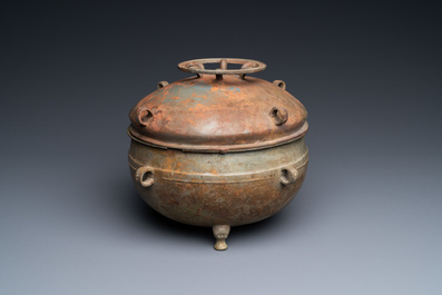 A Chinese bronze ritual tripod 'zhan' food vessel and cover, middle to late Spring and Autumn period