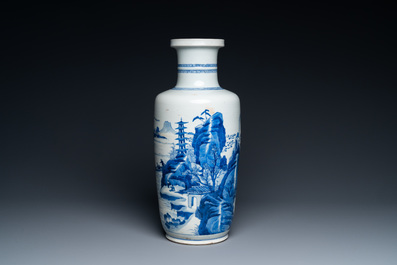 A Chinese blue and white rouleau vase with figures in a mountainous landscape, Kangxi