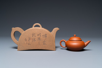 Two Chinese Yixing stoneware teapots with engraved inscriptions, 20th C.